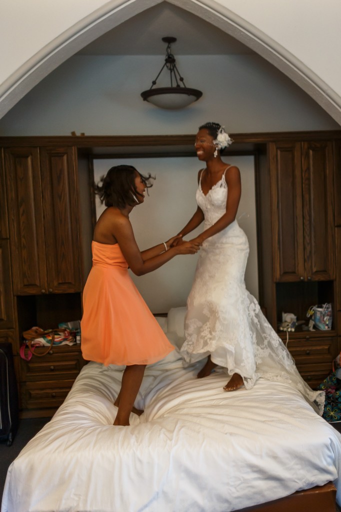 bridesmaids jumping on bed 