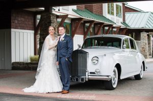 Bride and groom pose for a photo