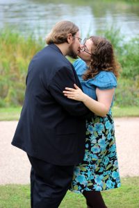 the bride and groom kiss