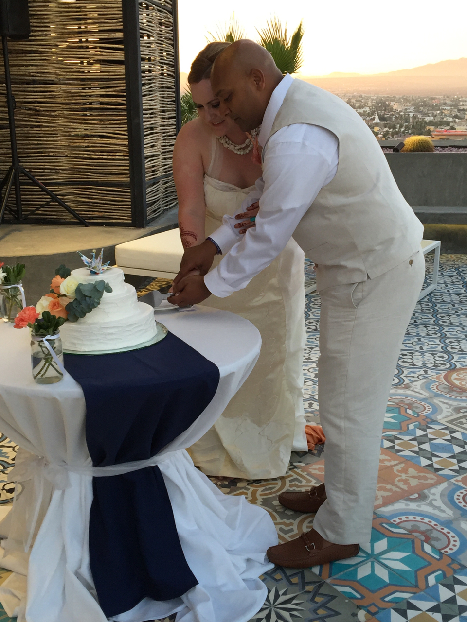 Alicea and Arvin cutting wedding cake