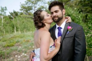 incredibly unique wedding - bride kissing groom's cheek