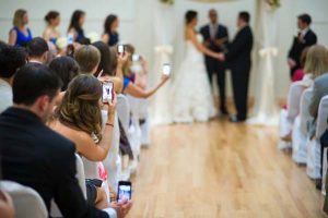  wedding guests block photographer