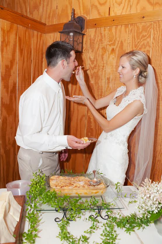 bride and groom eating wedding cake